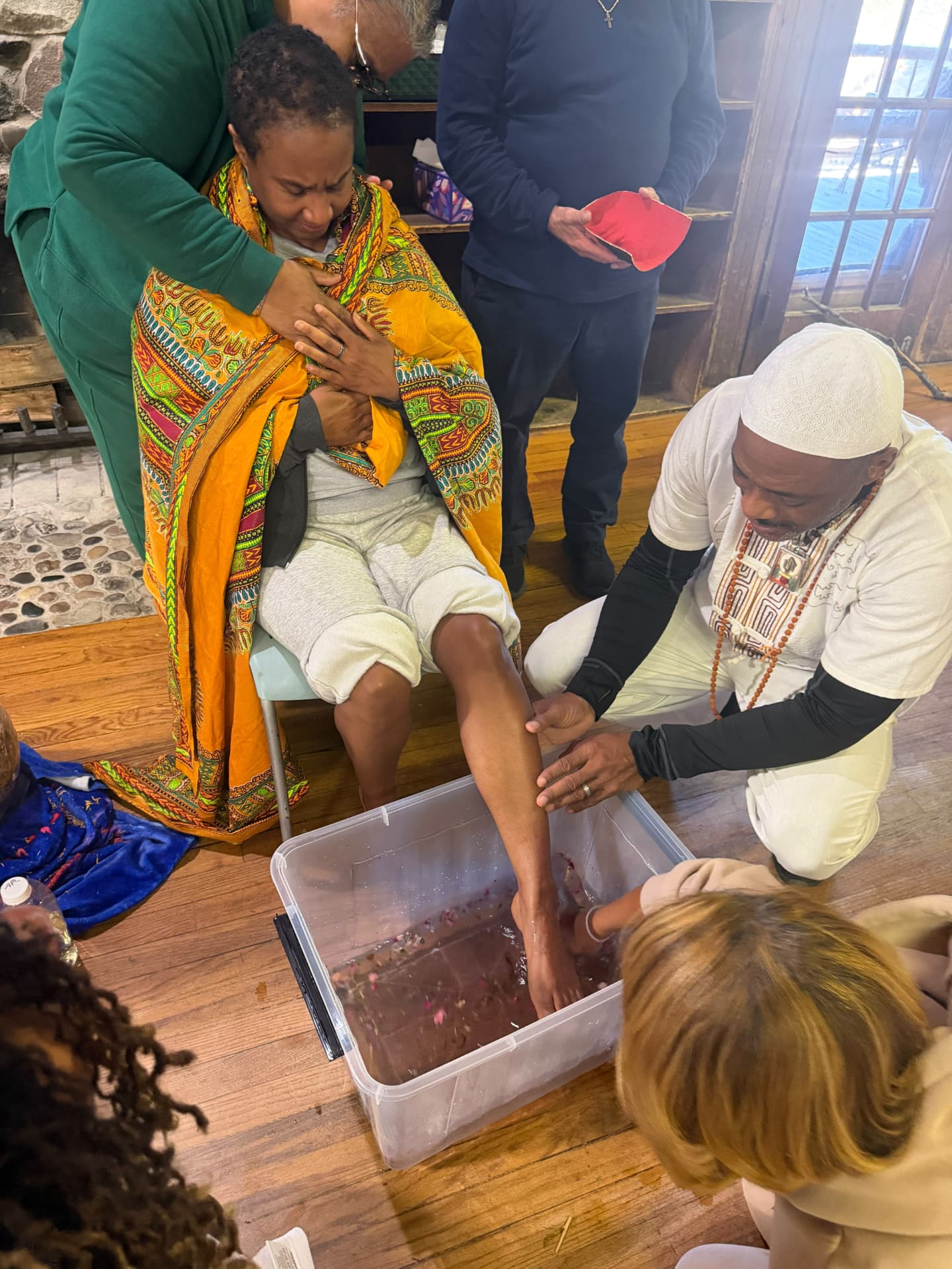 A moment from the SoulTribes ritual at Camp Cavell — hands in blessing
